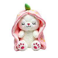 White plush toy with pink hood and green top on a white background