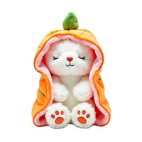 Plush toy resembling a white animal in an orange costume with a green top, on a white background